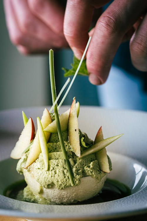 Preparing a Pistachio Ice Cream Dessert Decorated with Apple Slices