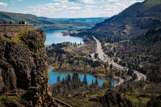 Breathtaking vista of Rowena Crest at Columbia River Gorge with lush valleys and winding roads.