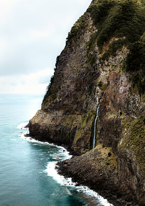 Waterfall on Cliff Hill on Coastline