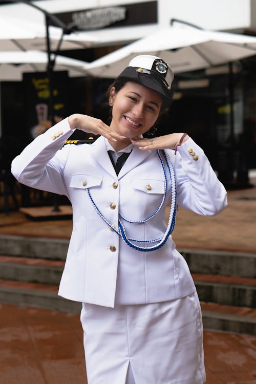 A woman in uniform posing for a picture