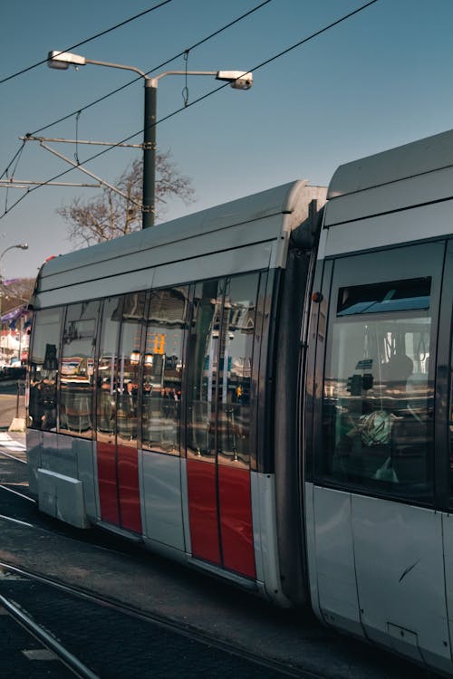 A white and red train on the tracks