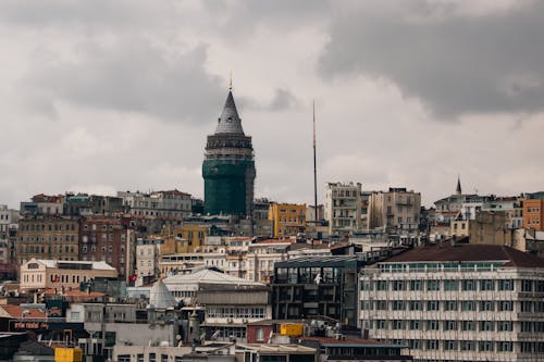 A city with many buildings and a clock tower