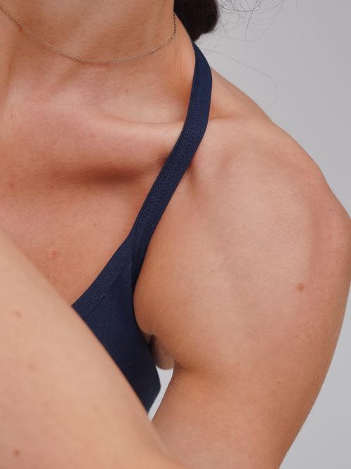 Free Detailed view of a woman's shoulder in athletic clothing, highlighting fitness and healthy skin. Stock Photo