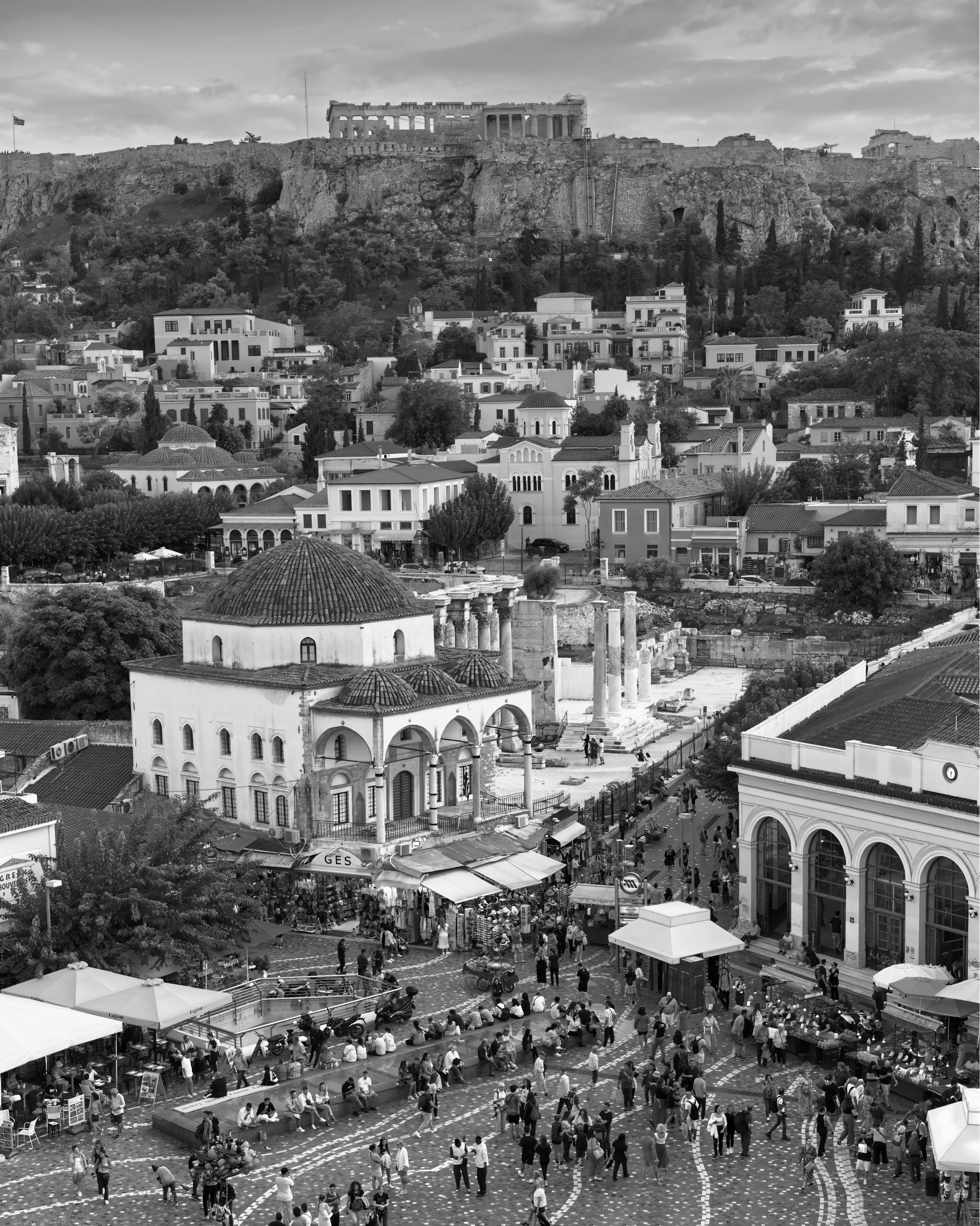 Black and white view of Athens showcasing the Acropolis above Monastiraki Square.