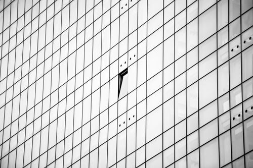 Free Black and white image of a modern skyscraper facade in Bilbao showcasing an open window. Stock Photo