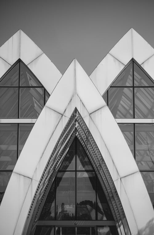 Free Black and white photograph of a building with triangular windows Stock Photo