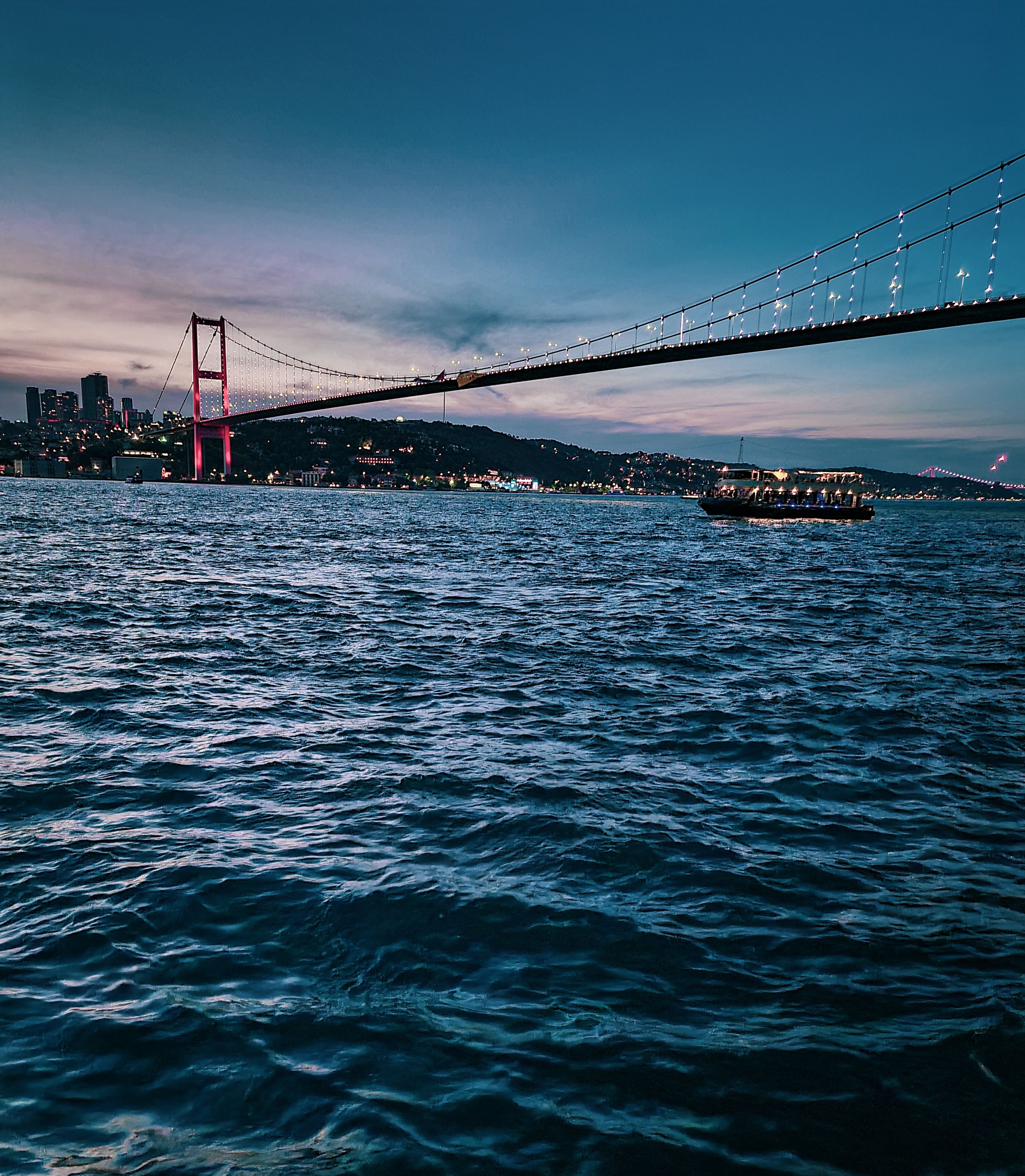 Scenic view of the Bosphorus Bridge over the Bosphorus Strait in Istanbul at twilight.