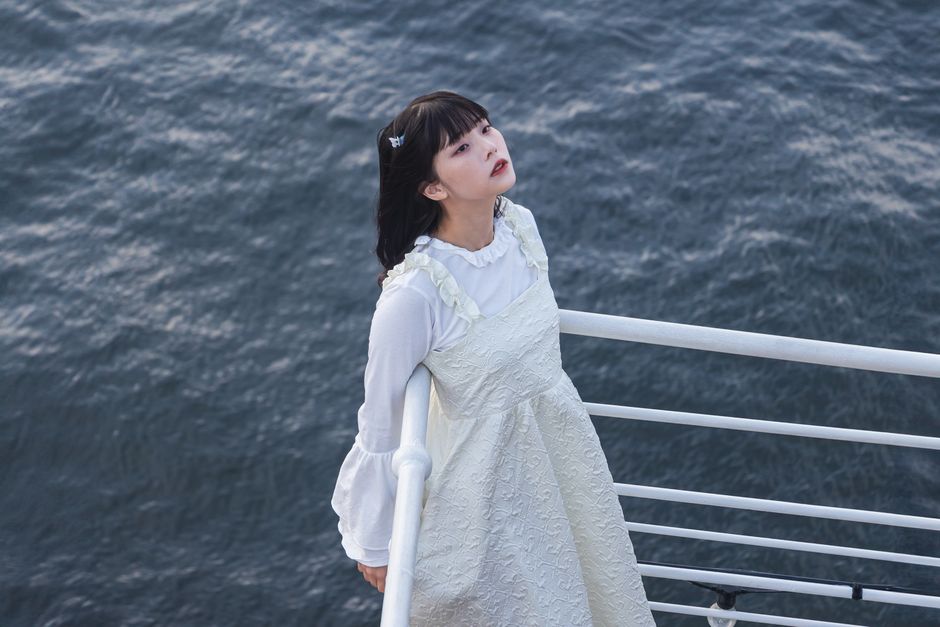 A serene moment of reflection by the sea in Yokohama, Japan.