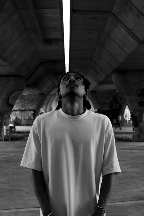 Man in Tshirt under Concrete Bridge