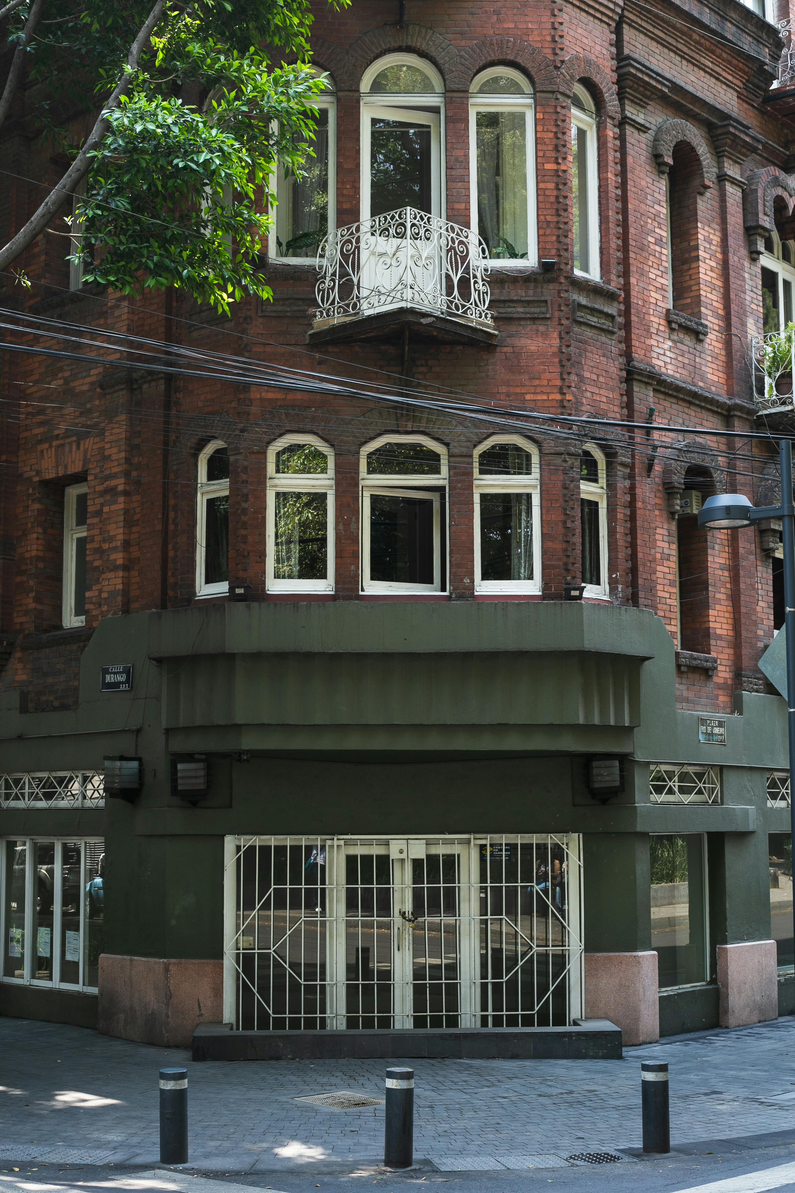 Free Charming brick building with ornate balconies in Mexico City's Roma neighborhood. Stock Photo
