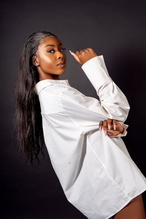 A woman in a white shirt posing for a photo