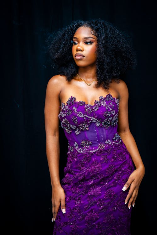 Photo of a Young Woman Wearing an Embroidered Purple Dress