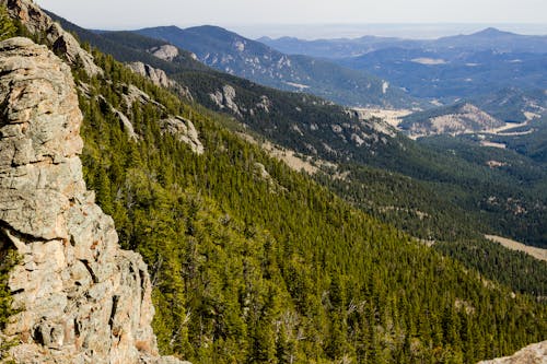 A view of the rocky mountains from a cliff