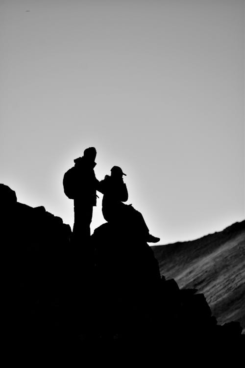 Free stock photo of at the top, black and white, climbers