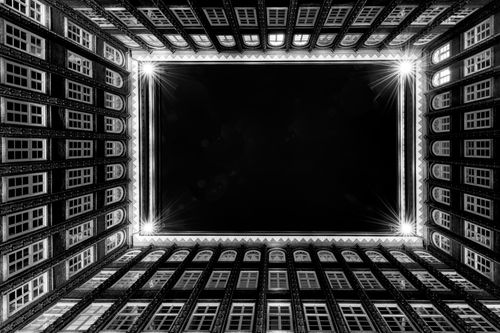 Free Monochrome perspective of the iconic Chilehaus courtyard in Hamburg, Germany, showcasing its architectural elegance. Stock Photo