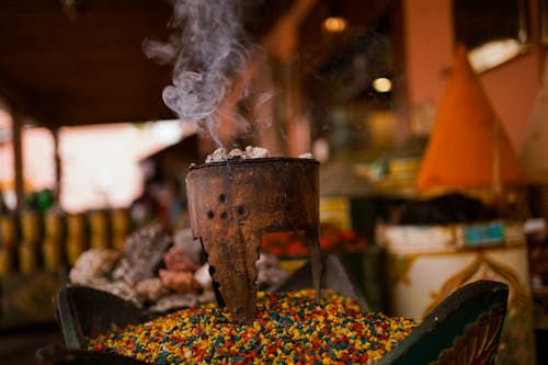 Free A bowl of colorful spices and herbs on a table Stock Photo