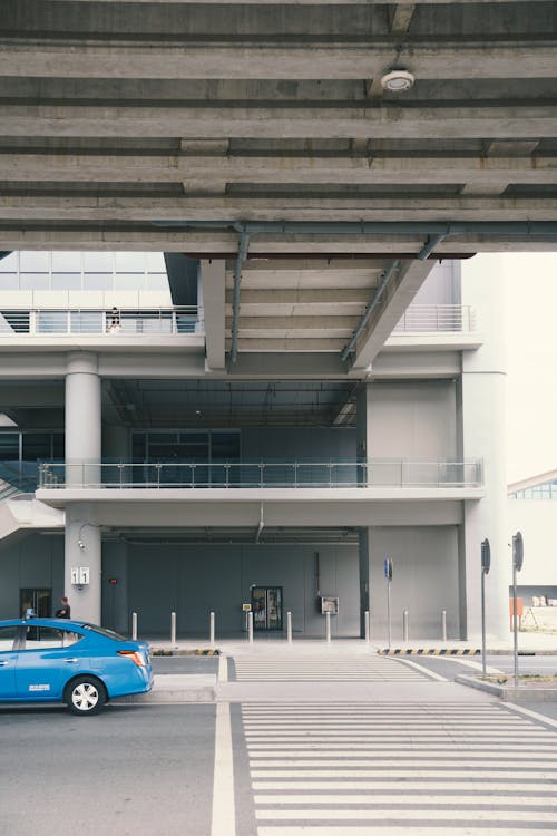 Pedestrian Crossing on Street Under Overpass in City