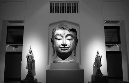 A black and white photo of a buddha statue