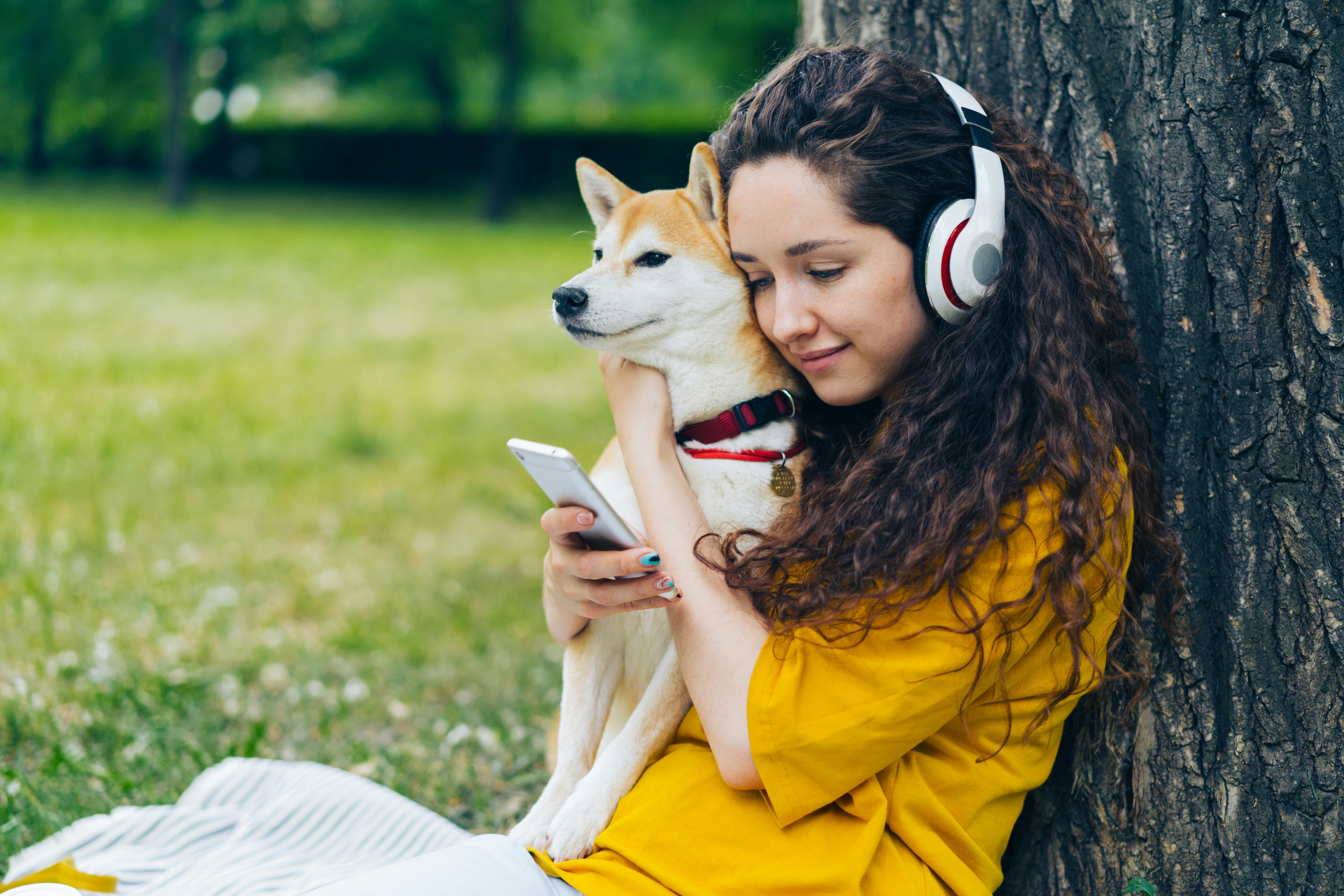 Woman with Smartphone and Dog