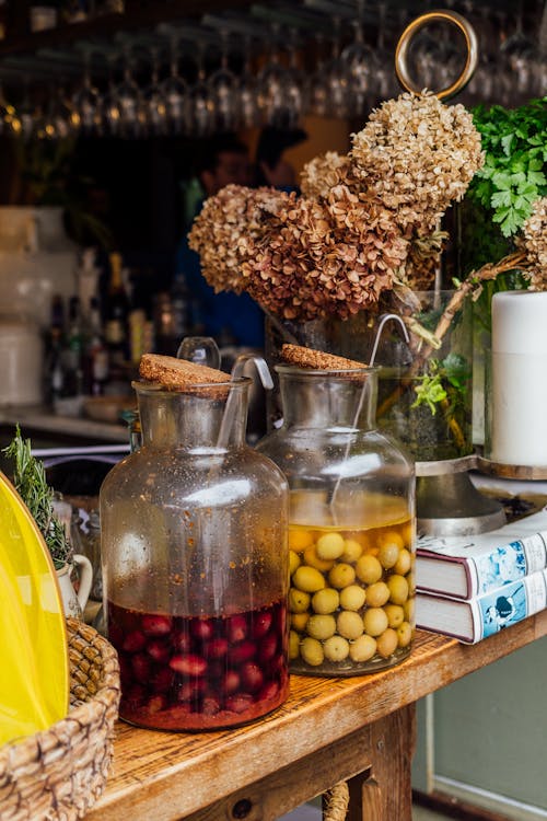 Free A bar with jars of olives and flowers Stock Photo