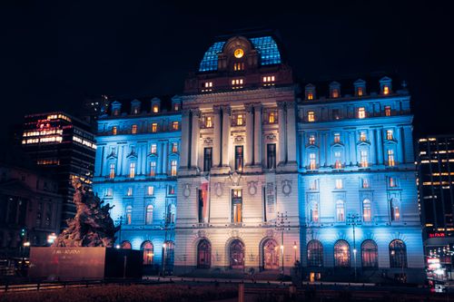 Free Centro Cultural Kirchner illuminated in blue lights, Buenos Aires urban landmark at night. Stock Photo