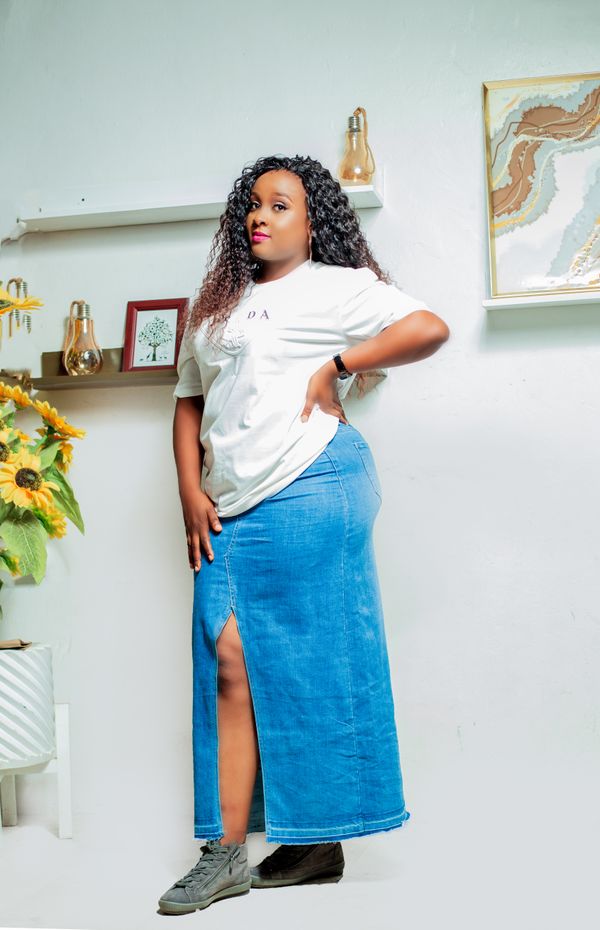 Woman in maxi skirt with tucked t-shirt