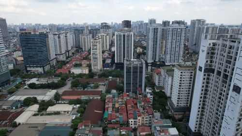 Free Drone view of modern skyscrapers and residential buildings in Thanh Xuân, Hà Nội, Vietnam. Stock Photo