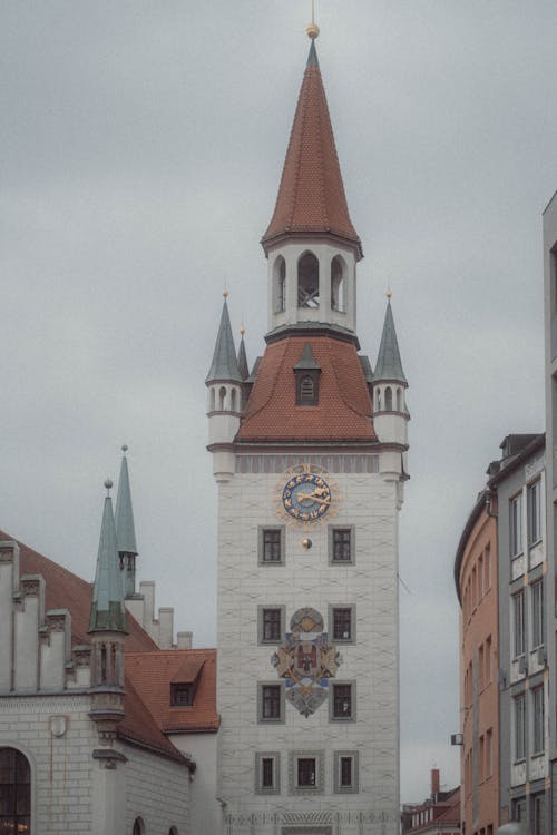 A clock tower with a clock on it in a city
