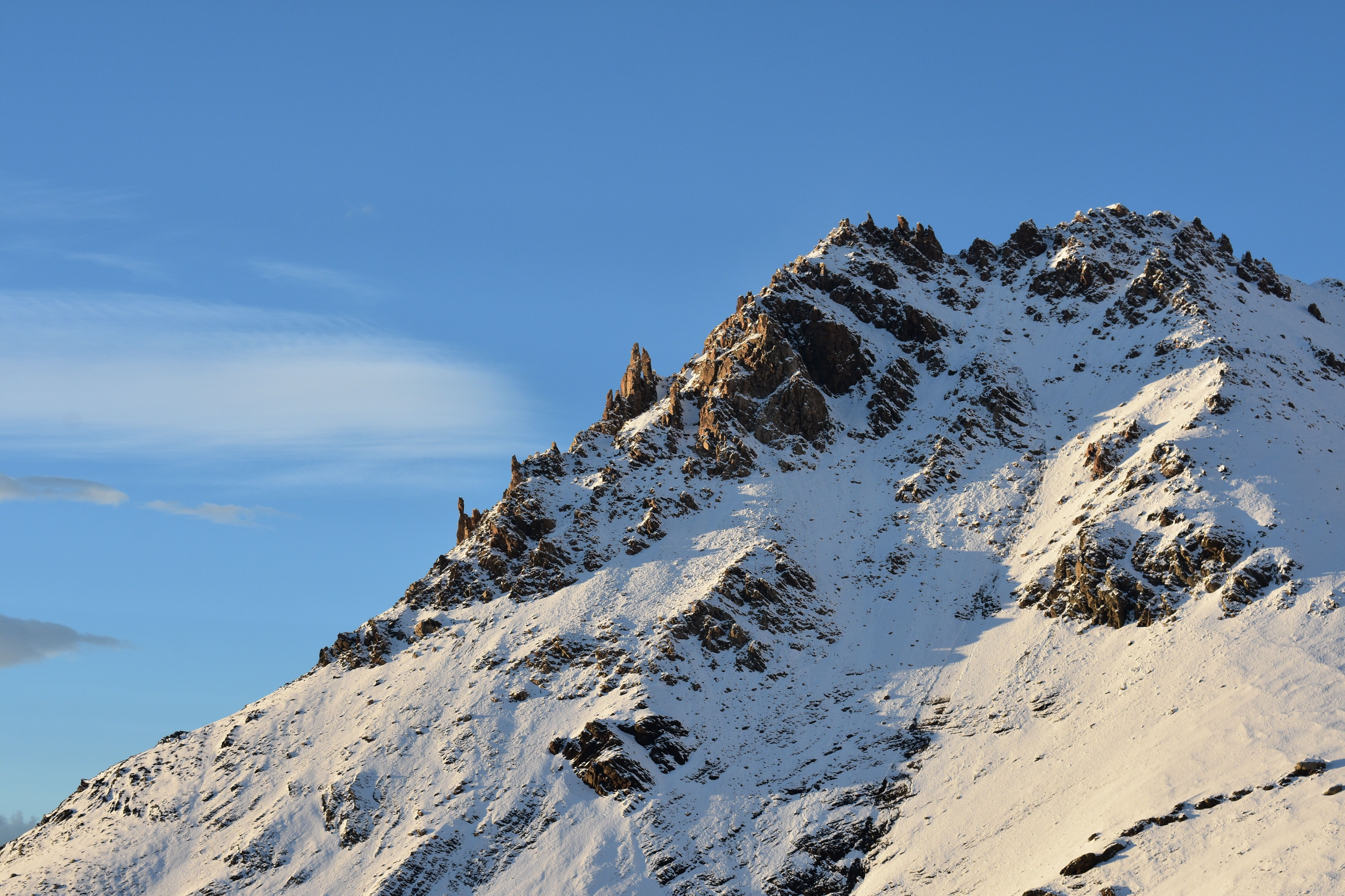 Snow on the Guadarrama ridge seen behind Segovia's Alcazar on a clear winter morning