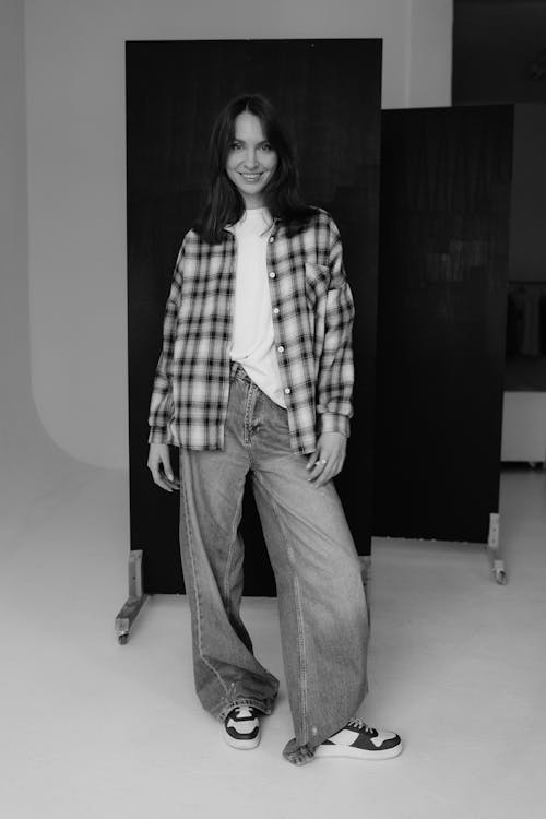 Black and White Photography of a Woman in a Plaid Shirt