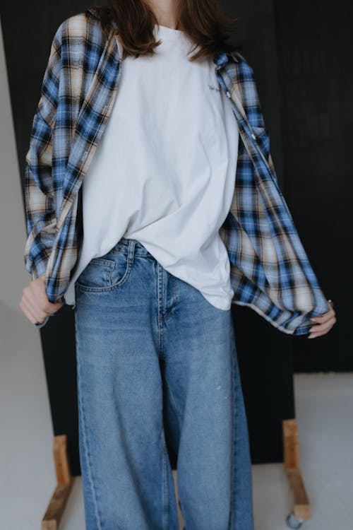 Free A woman in a plaid shirt and jeans Stock Photo