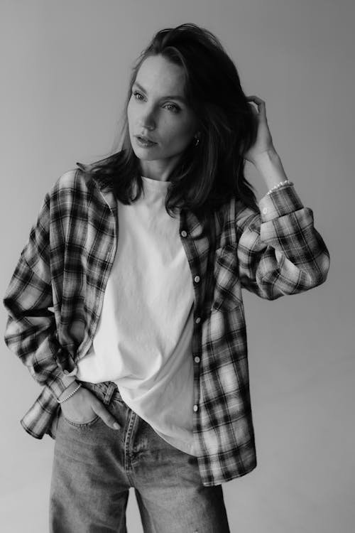A woman in a plaid shirt and jeans