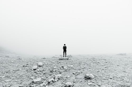 Hiker Standing in Front of a Wall of Fog