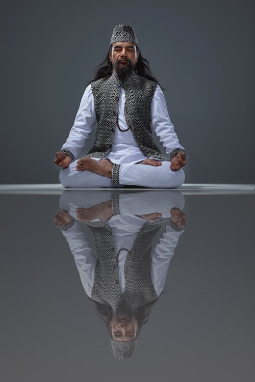 A man meditating in a lotus position