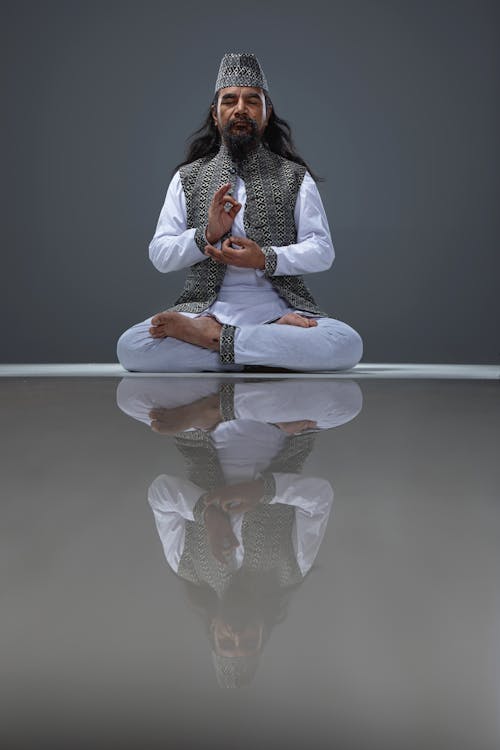 A man sitting in meditation with his eyes closed