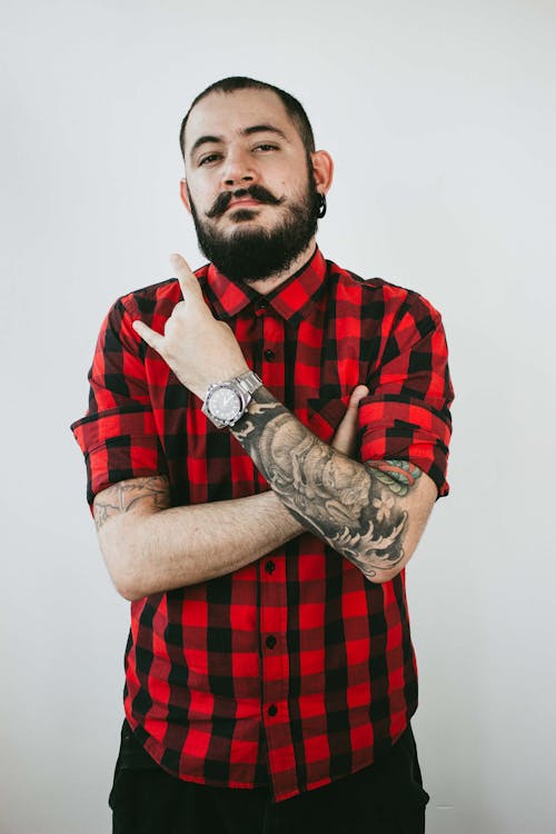 Free Unknown Celebrity Wearing Red and Black Plaid Button-up Sport Shirt Stock Photo