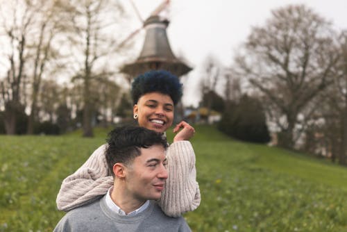 A couple in front of a windmill