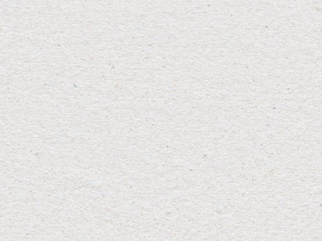 High-resolution textured white paper background ideal for design projects.