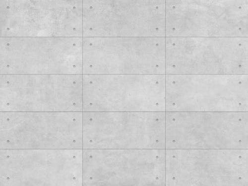 A gray tile background with holes in it