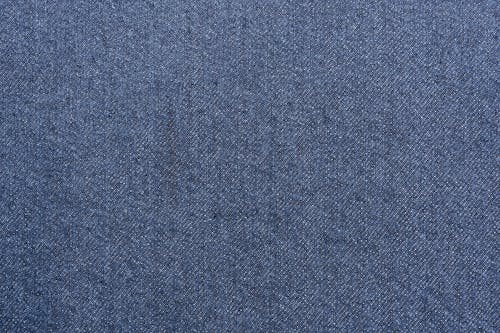 A blue fabric with a small hole in it