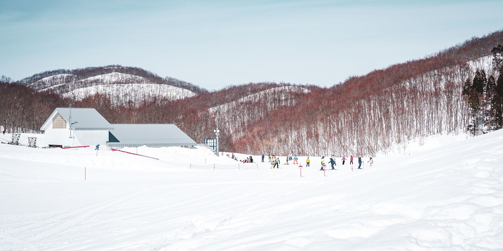 Skiers on snow-covered slopes at a winter resort
