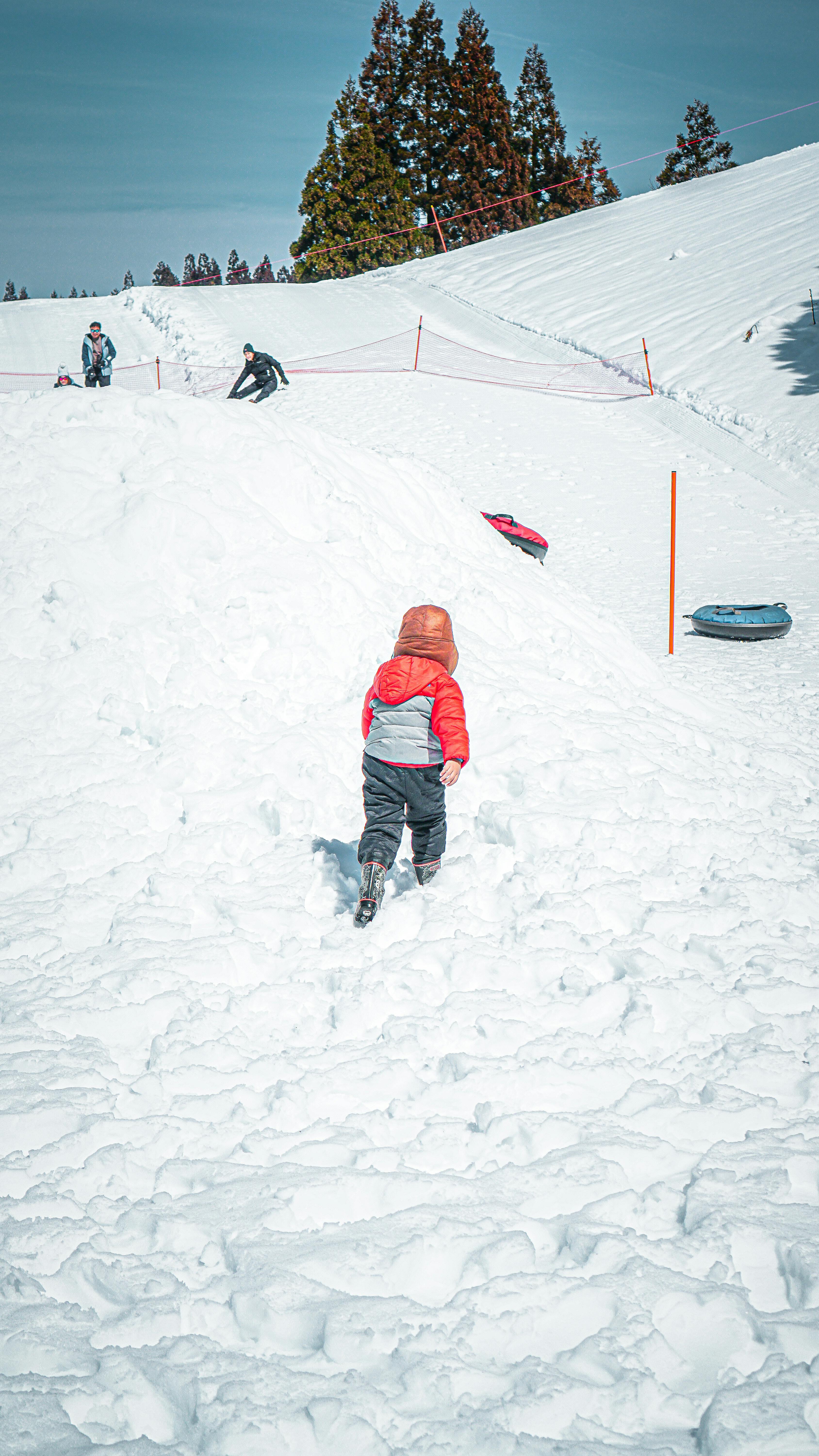 Prescription Goggle Inserts - A child in winter gear plays in the snow on a ski slope in Yuzawa, Japan.