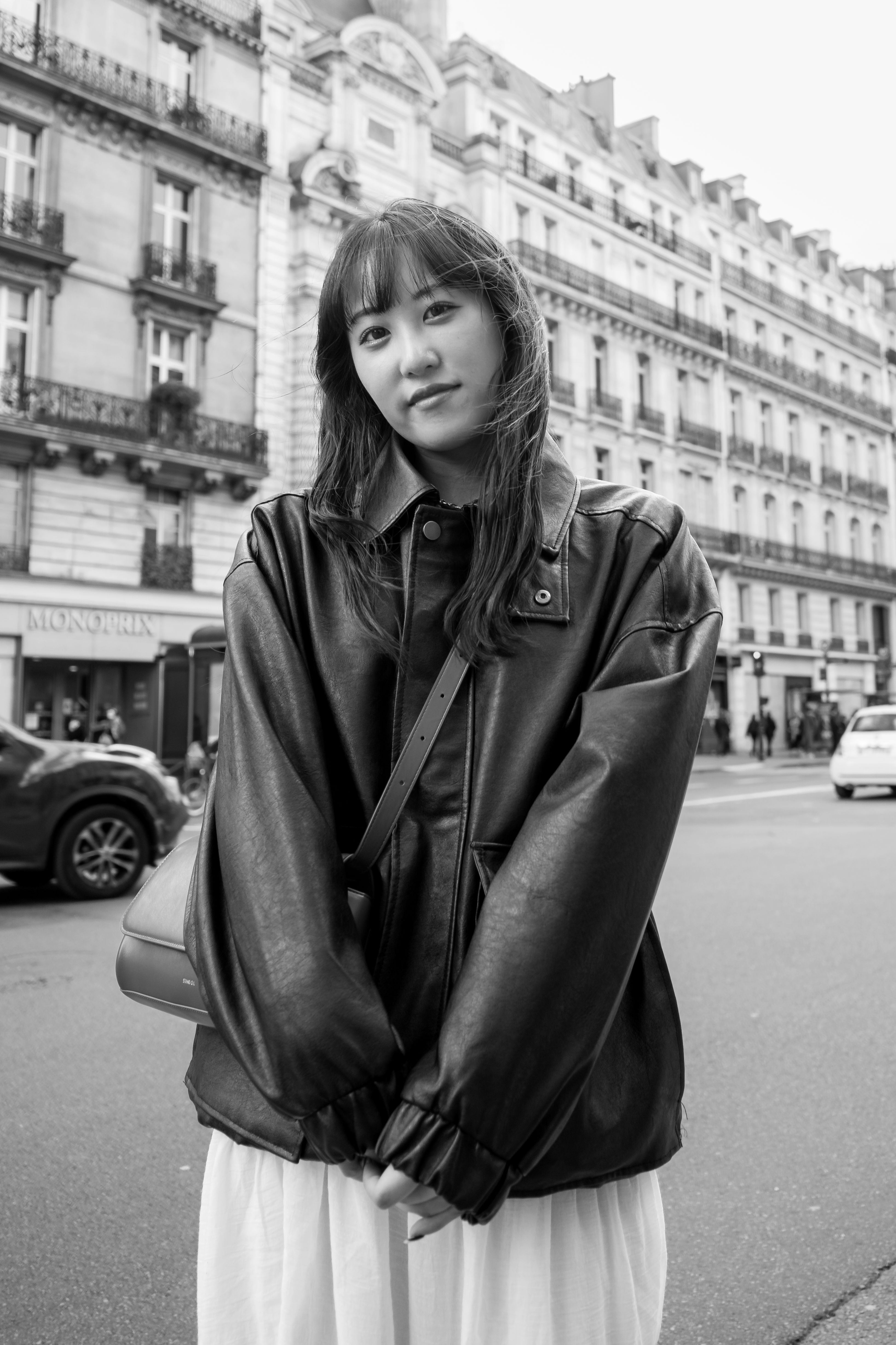 Black and White Photo of a Young Woman in a Leather Jacket Standing on ...