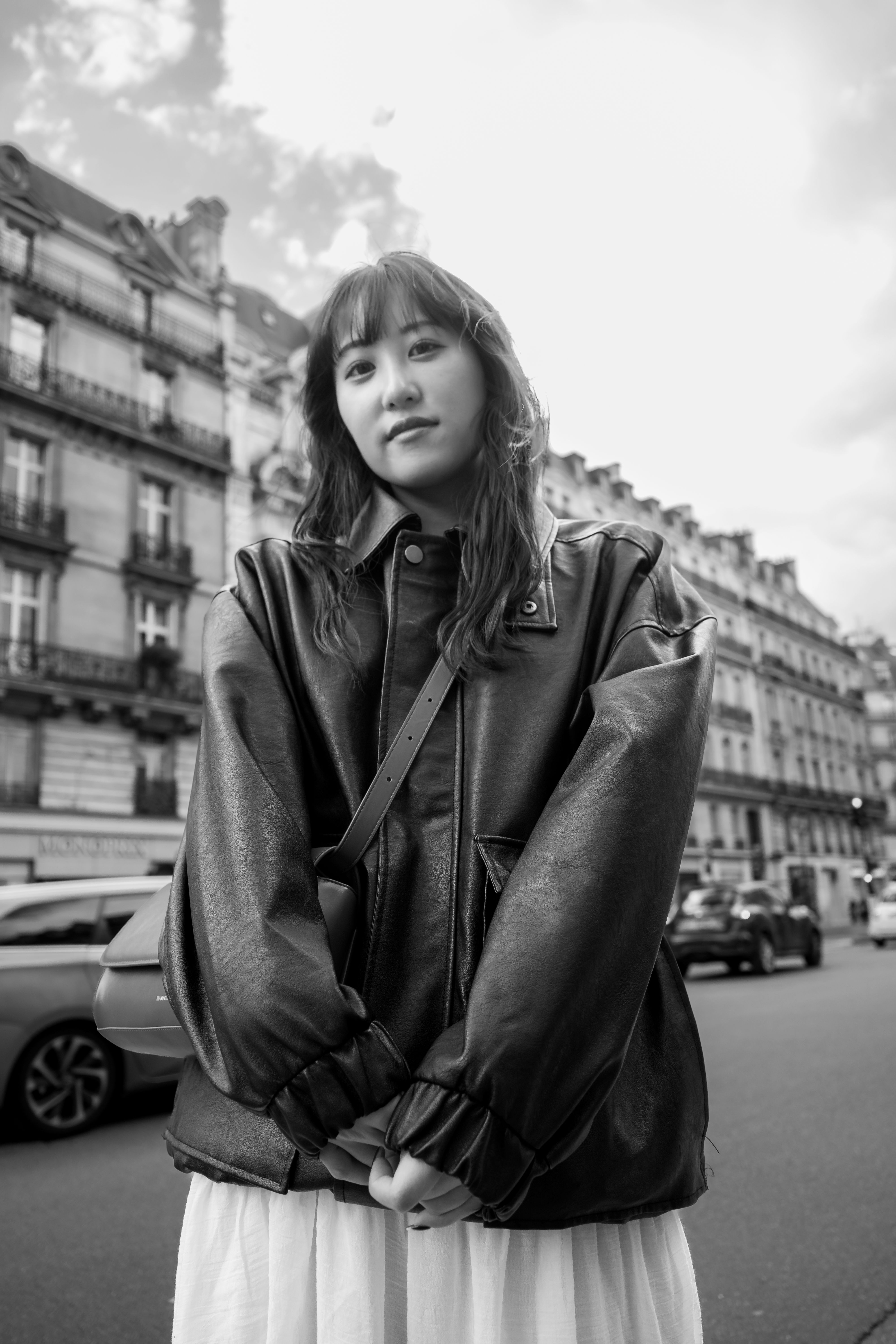 Black and White Photo of a Young Woman in a Leather Jacket Standing on ...