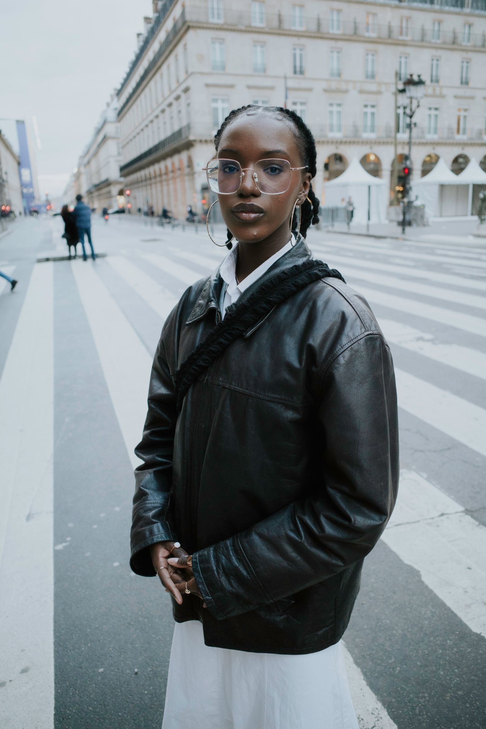 Woman in a black leather jacket on a Paris street