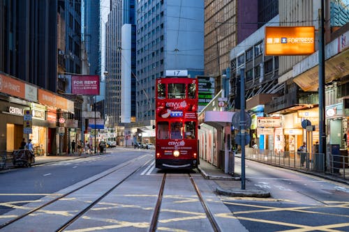 A red double decker bus on a city street