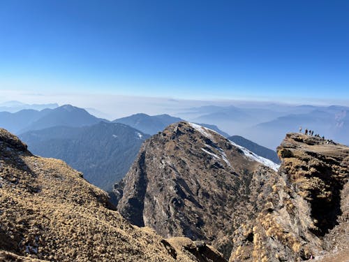 A view of the mountains from the top of a mountain