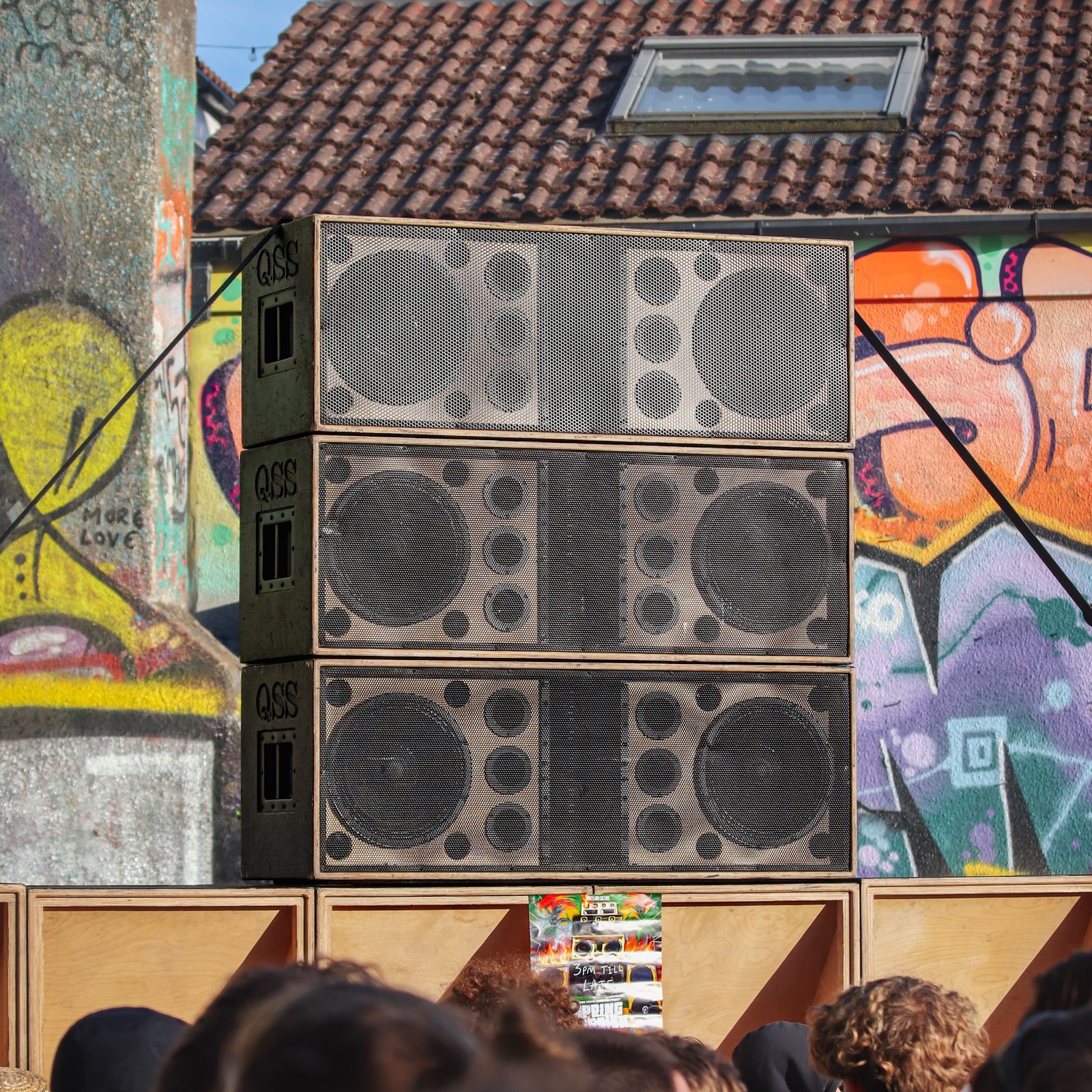 Speaker wall covered in graffiti