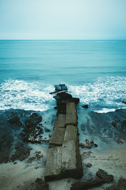 Foto d'estoc gratuïta de escullera, horitzó, mar
