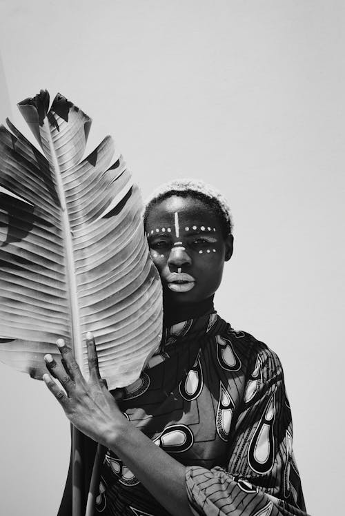 Portrait of Woman Holding Leaf in Black and White